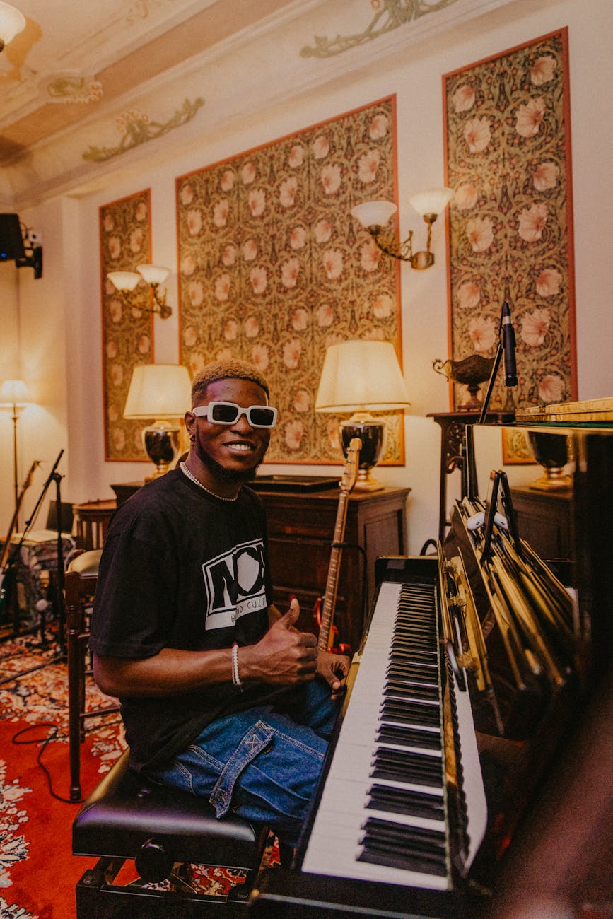 musician playing piano in stylish hotel lounge